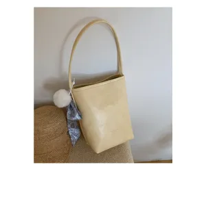 Summer minimalist bucket bag for women, stylish PU leather shoulder handbag with scarf.