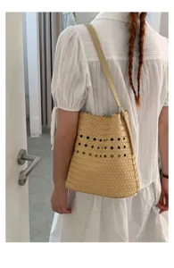 Sommer gewebte hohle Eimer Tasche für Damen, schicke Schulter Unterarm Umhängetasche.