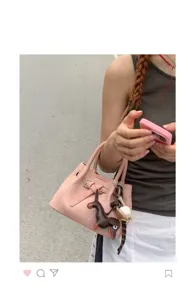 Pink mini canvas tote bag with cute dog charm, stylish shoulder handbag for women details.