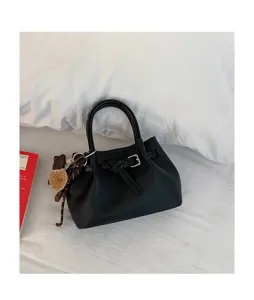 Minimalist black PU leather handbag for women, chic top handle tote bag for daily use.