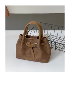 Textured mini tote handbag for women, chic top handle shoulder bag with stylish front buckle detail.