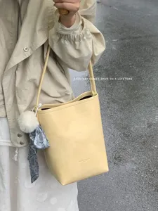 Chic summer niche textured bucket bag minimalist shoulder bag for women stylish daily wear