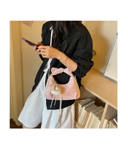 Pink polka dot crescent handbag with bow handle and heart charm, stylish daily shoulder bag.