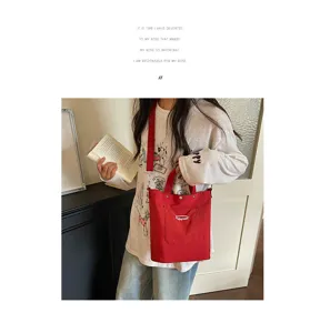 Sac seau en toile décontracté style coréen, sac bandoulière rouge avec poignée et poche.