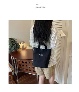 Sac seau en toile décontracté style coréen avec bandoulière et imprimé lettres pour femmes.