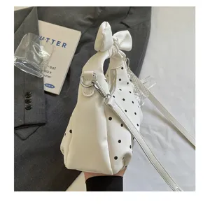 White polka dot hobo shoulder bag with cute bow handle, stylish casual crossbody bag.