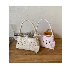 Woven underarm handbag detail, stylish hollow design shoulder bag for women, chic commuter tote.