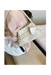 Chic woven underarm bag for women, stylish hollow shoulder handbag for daily commute and dating.