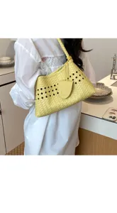 Yellow woven cutout shoulder bag for women, stylish faux leather underarm handbag for daily commute.