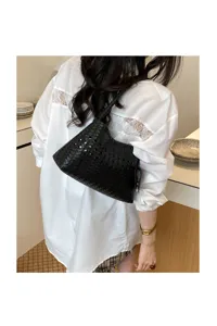 Woven leather underarm bag, trendy black shoulder tote, chic casual commuter handbag.