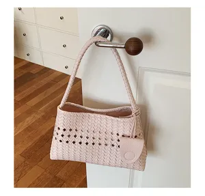 Pink woven leather underarm handbag, stylish casual shoulder bag for women daily commute lifestyle.