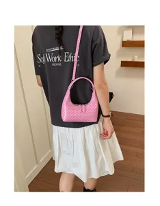 Stylish pink polka dot crescent shoulder bag for women, cute patent leather hobo handbag.