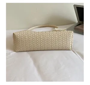 Woven leather underarm bag detail, elegant white chic shoulder purse, minimalist commuter handbag.