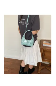 Stylish light green polka dot crescent shoulder bag, minimalist hobo bag for women.