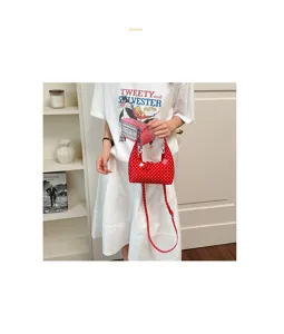 Red polka dot handbag minimalist hobo bag stylish patent leather crossbody bag details view