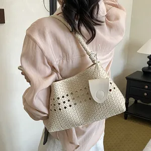 Elegant beige woven shoulder bag for women, chic hollow-out underarm commuting handbag.