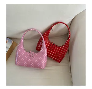 Stylish polka dot hobo shoulder bag for women, chic crescent PU leather handbag for daily wear.