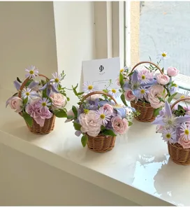 Handmade woven flower basket with fresh roses and daisies for home decor detail
