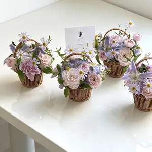 Handmade woven flower basket with cute pink purple flowers for desktop home decoration.