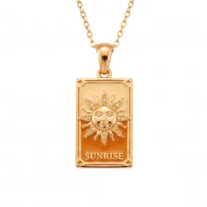 Close-up detail of the gold tarot card sun pendant necklace, stainless steel jewelry design.