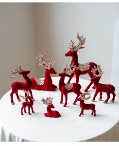Red flocked Christmas reindeer figurines set with sequin antlers for holiday desktop table decor
