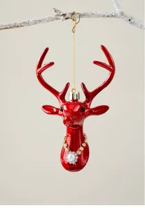 Close-up detail of the glossy red reindeer Christmas ornament with rhinestone pearl necklace.