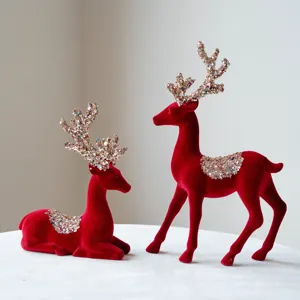 Red flocked Christmas reindeer figurines set for festive table and window decor, main view