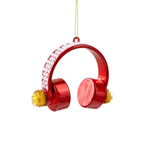 Red headphone Christmas ornament with white pearls and gold accents for tree decor.