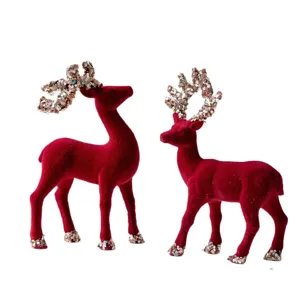 Christmas red flocked reindeer figurines with sequin antlers for festive desktop decor.