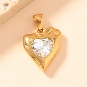Exquisite gold heart pendant detail with sparkling clear crystal. Perfect for DIY jewelry crafting.