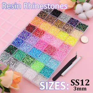 Detailed view of 24-grid colorful flatback resin rhinestones, 3mm size DIY nail art accessories.