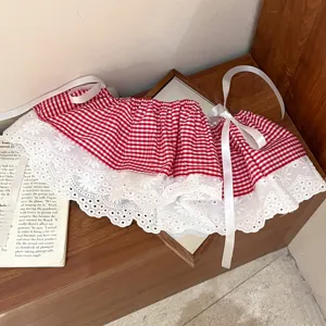 Korean style red gingham skirt extender with white lace trim and ribbon ties for layering women.