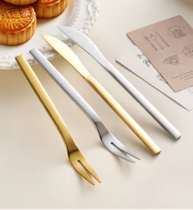Stainless steel dessert knife and fork set, elegant cutlery for mooncakes and fruit.