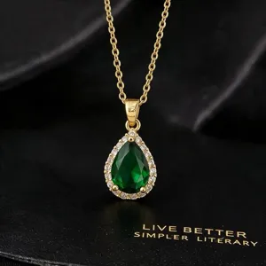 Elegant green pear cut cubic zirconia pendant necklace gold chain detail aesthetic jewelry