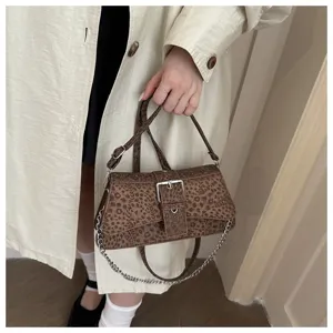 Trendy leopard print women shoulder bag, stylish baguette bag with chain and buckle.