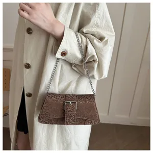 Brown textured baguette shoulder bag with stylish silver chain strap and front buckle detail.