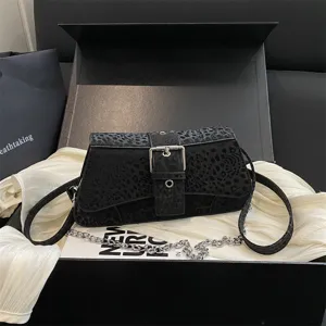 Black leopard texture shoulder bag with metal chain and buckle, stylish baguette purse for women.