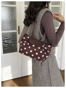 Brown polka dot shoulder bag for women, cute versatile niche tote bag with flap design.