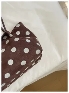Brown suede polka dot tote bag detail view, minimalist daily shoulder bag for women.