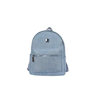 Light blue denim backpack with rhinestone details, front zipper pocket, and silver hardware.