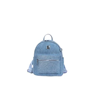 Close-up front view of blue denim mini backpack showing front zipper pocket and metal hardware.
