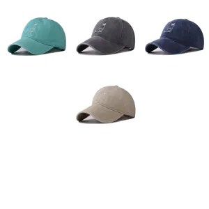 Detailed view of washed cotton baseball cap featuring cute heart and palm tree embroidery.