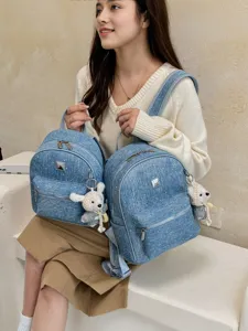 Casual denim backpack for women stylish student school bag with cute bear pendant and star pattern.