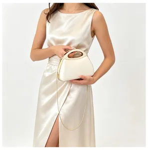 Elegant white acrylic hard shell evening bag with luxury metal handle and chic chain strap.