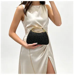 Elegant rhinestone evening bag with metallic handle and chain strap for banquets and parties.