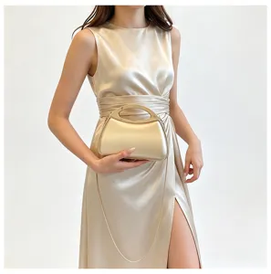 Elegant metallic hard shell evening bag with chain strap and ring handle for women chic look.