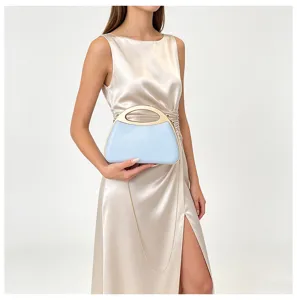Elegant light blue hard shell evening clutch bag detail, featuring metallic handle and chain.