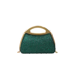 Detailed close-up of the sparkling green rhinestone evening clutch featuring a stylish gold handle.