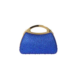 Blue rhinestone evening clutch bag with gold metal handle and chain for party dress.