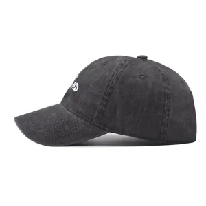Detailed side view of black washed distressed cotton baseball cap with embroidery.